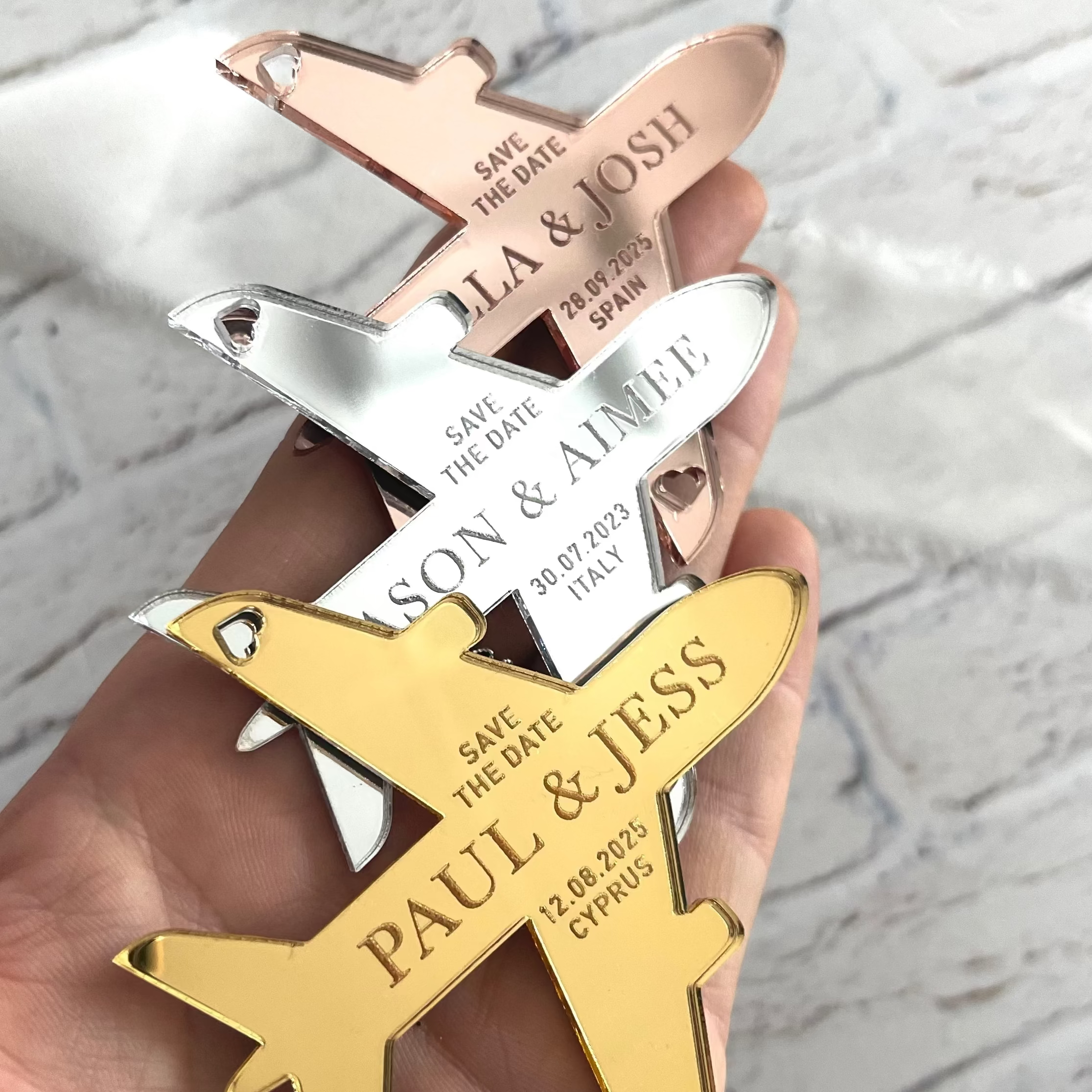 keepsake save the date fridge magnets in a plane shape for destination weddings