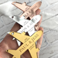 keepsake save the date fridge magnets in a plane shape for destination weddings