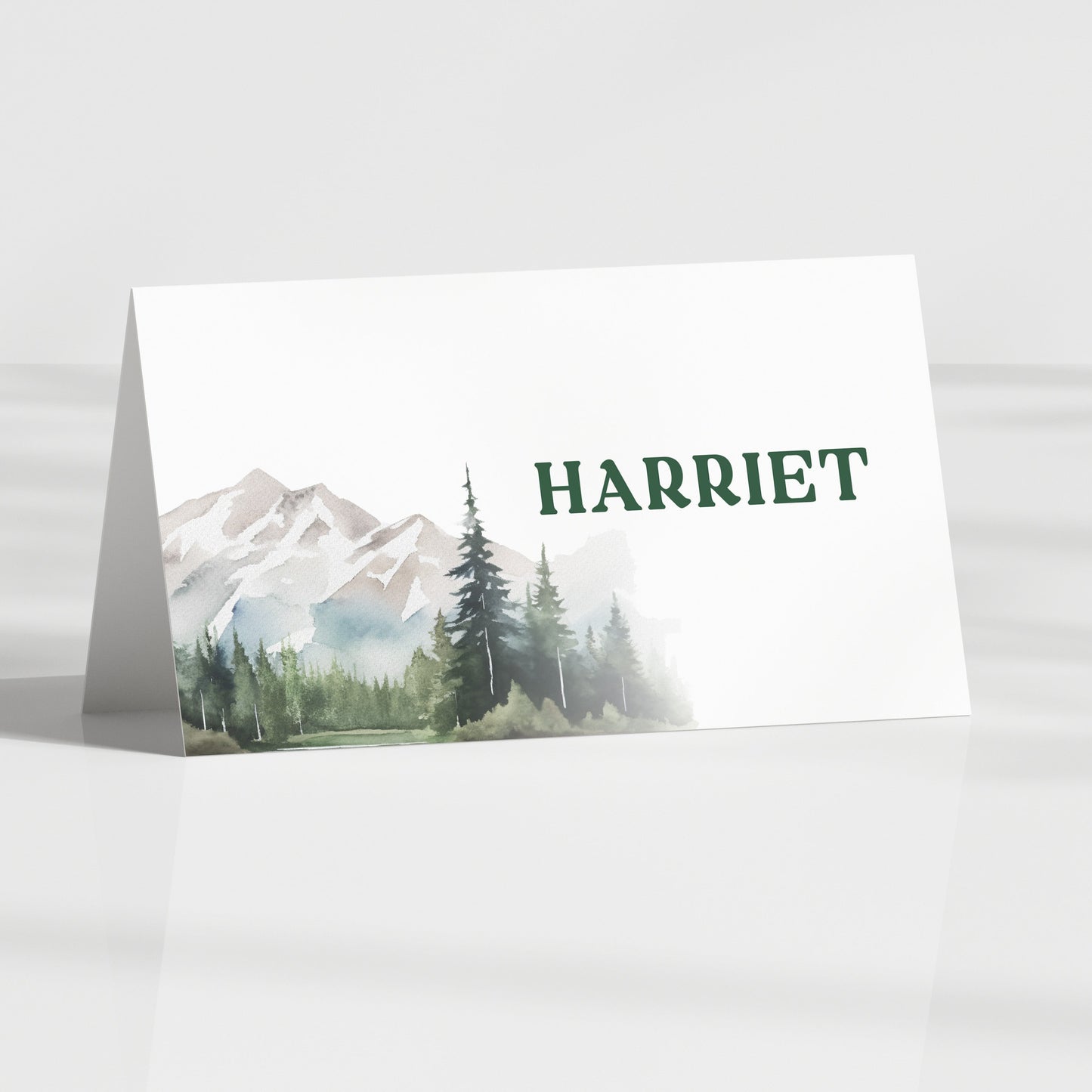 folded wedding guest name card with mountain and forest nature theme
