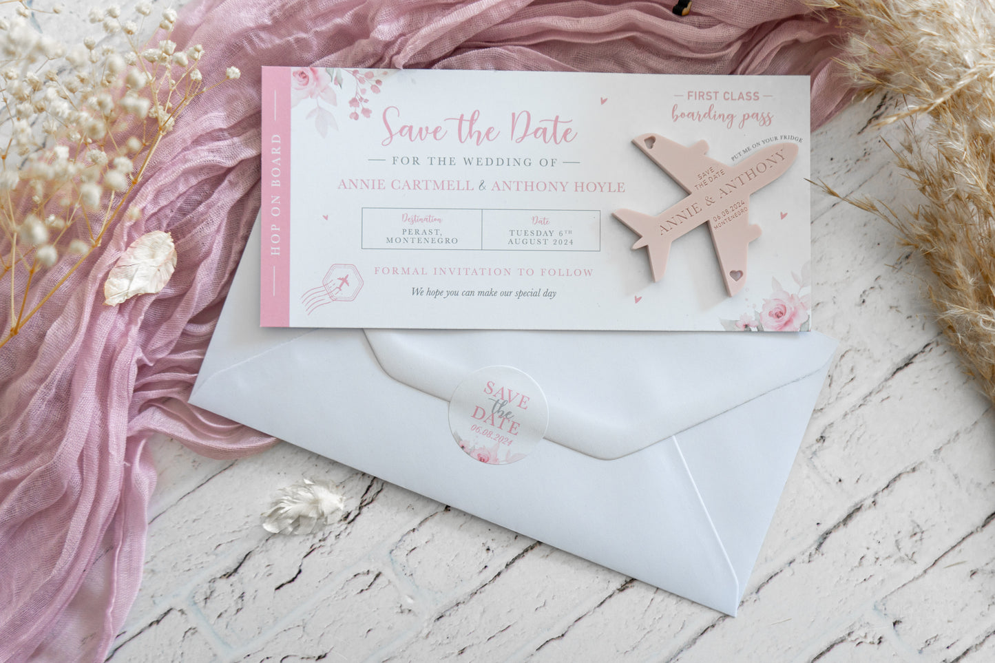 Pink floral Save the Date card with airplane fridge magnet for destination wedding