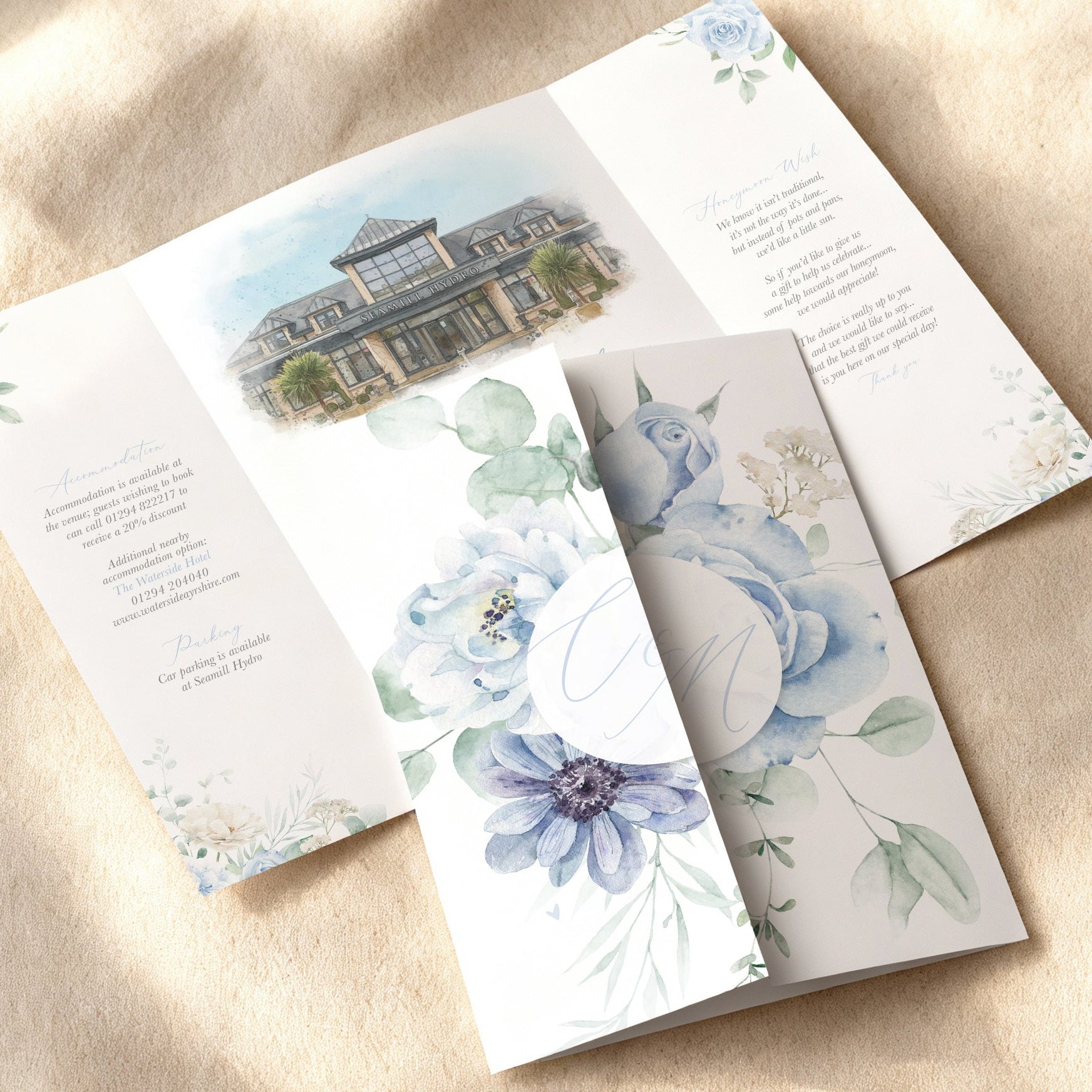 dusty blue floral folded wedding invitation with watercolour venue illustration of Seamill Hydro Scotland