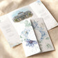 dusty blue floral folded wedding invitation with watercolour venue illustration of Seamill Hydro Scotland