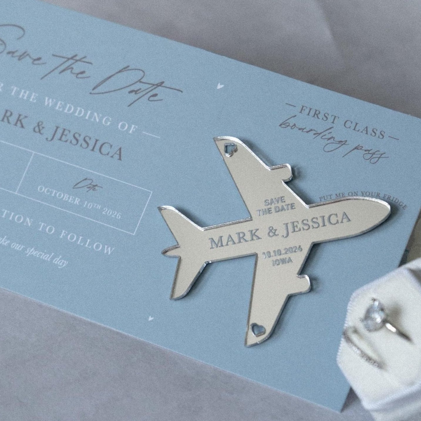 dusty blue boarding pass save the date with silver plane fridge maget keepsake
